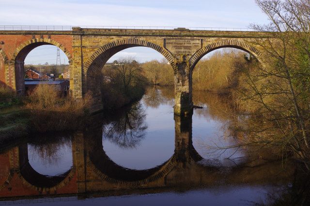Yarm railway viaduct arches reflected in the River Tees