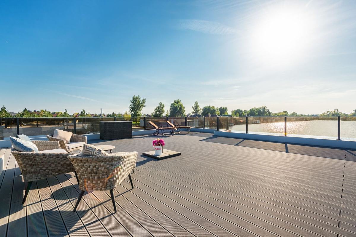 Raised deck with glass balustrade overlooking water